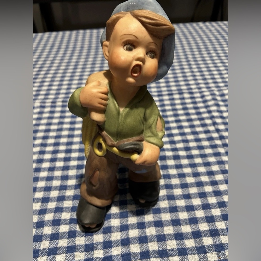Charming Figurine with Blue Hat and Green Shirt